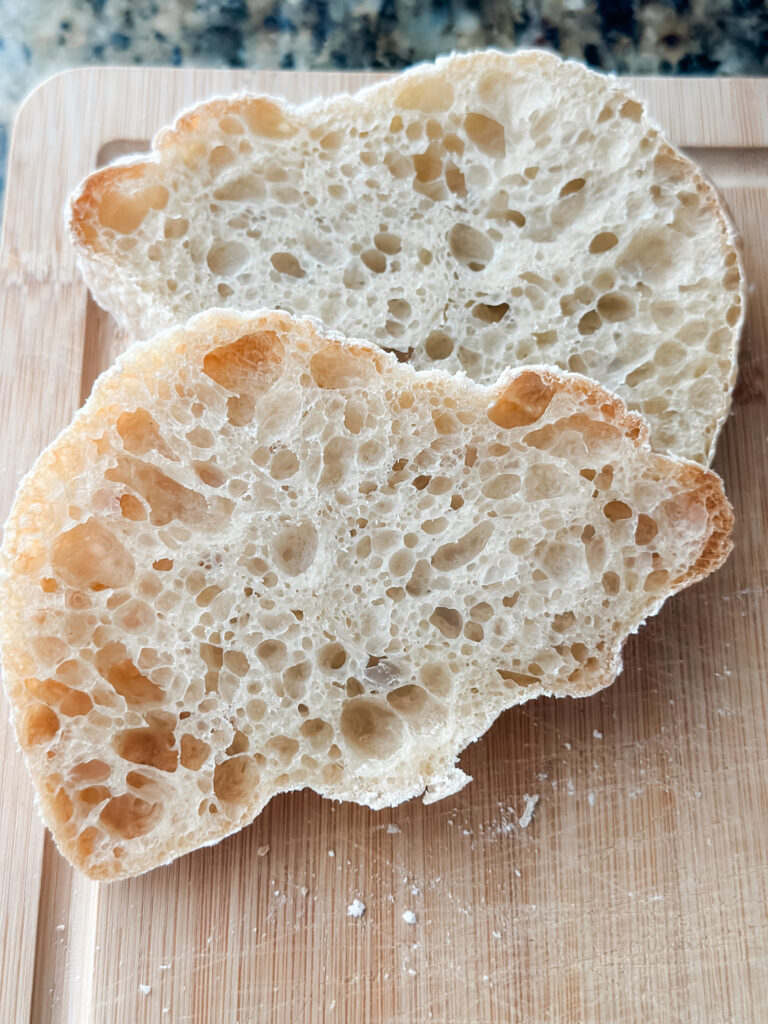 Beautiful sliced ciabatta bread on cutting board
